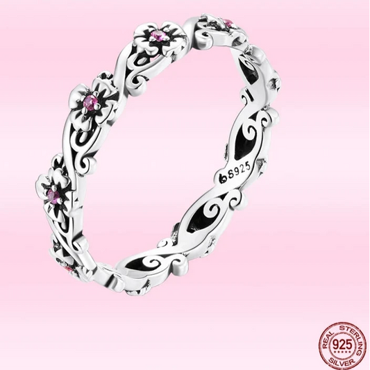 A sterling silver ring featuring a classic vintage pattern with zircon embellishments.