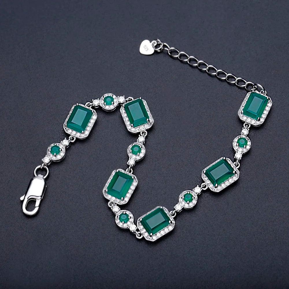 Bracelet with green gemstones on a dark background