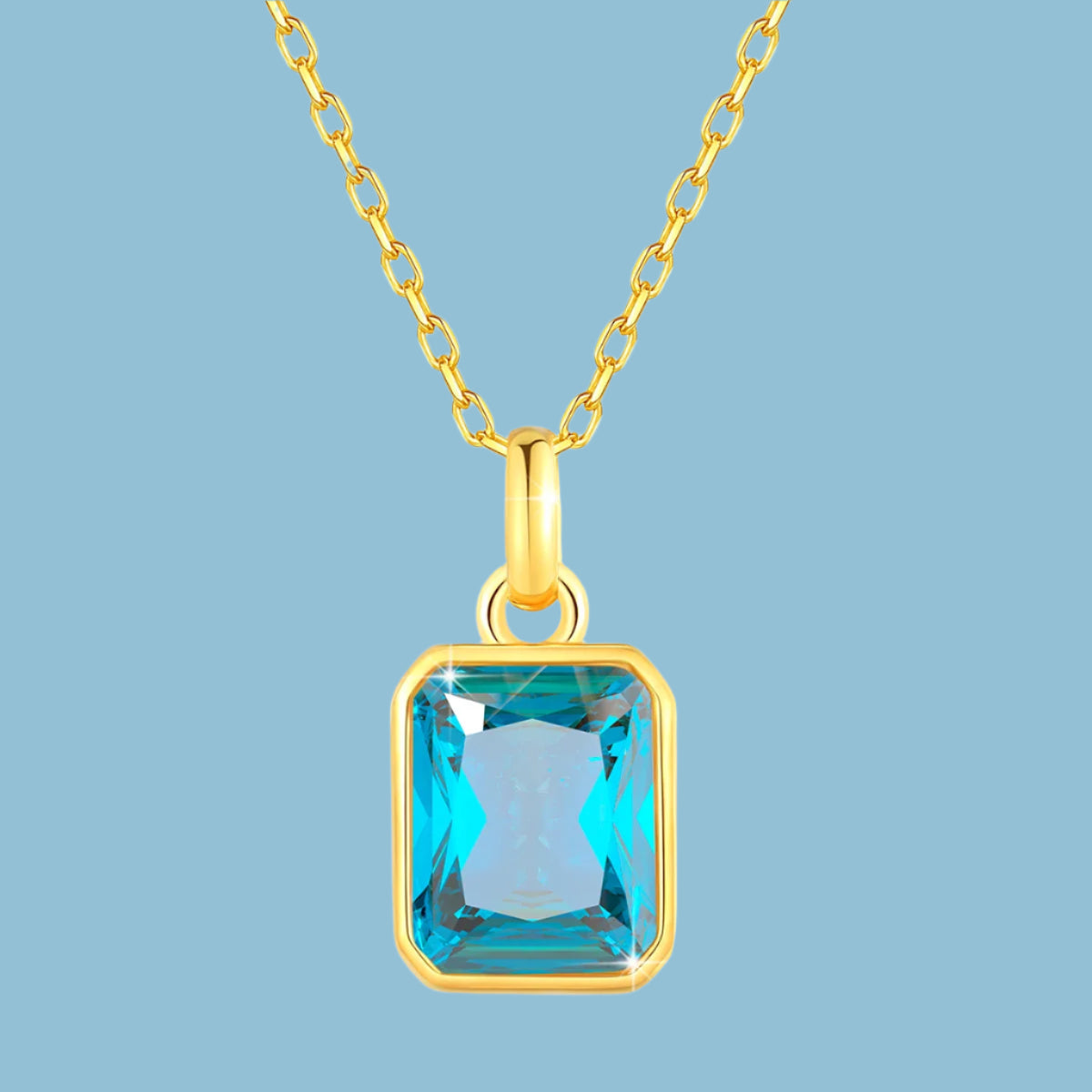 cubic zirconia pendant necklaces in blue elegant 18K gold-plated frames with matching gold chains. 