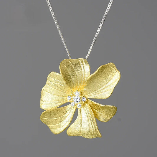 Luxury floral jewelry pendant necklace for women with sparkling zircon crystals and 18K gold plated flower design on a 925 sterling silver chain