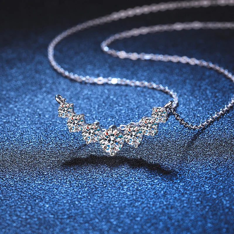 925 Sterling Silver Jewelry Necklace with Graduated Moissanite Stones and Curved Pendant Design


