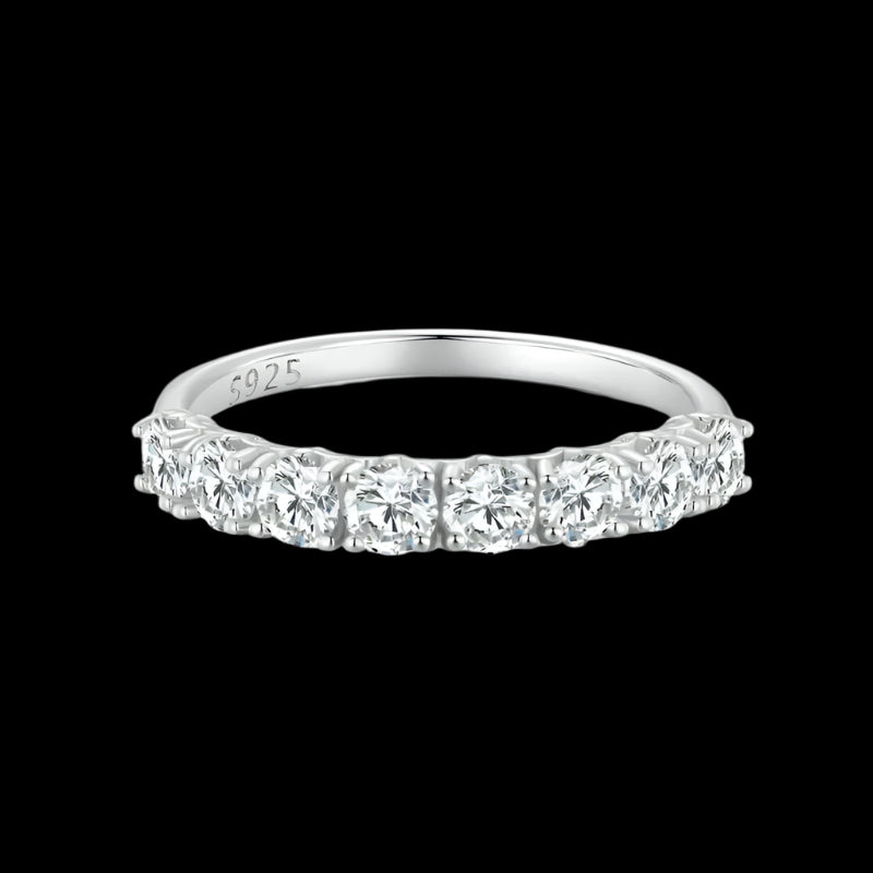 Silver ring with diamond stones on a black background