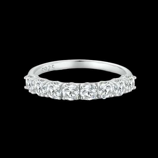 Silver ring with diamond stones on a black background