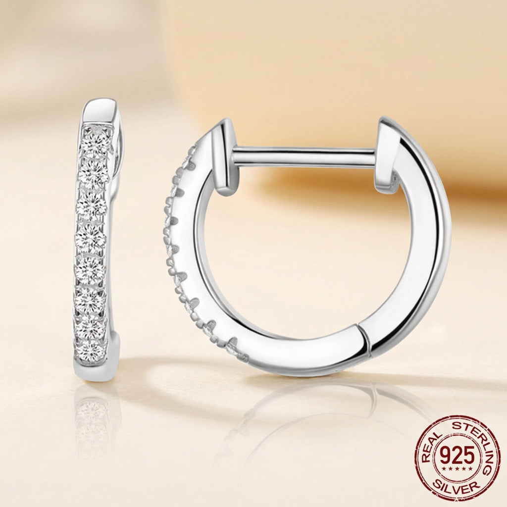 925 sterling silver huggie hoop earrings adorned with sparkling cubic zirconia stones, elegant luxury jewelry for women available in silver, gold, and black finishes
