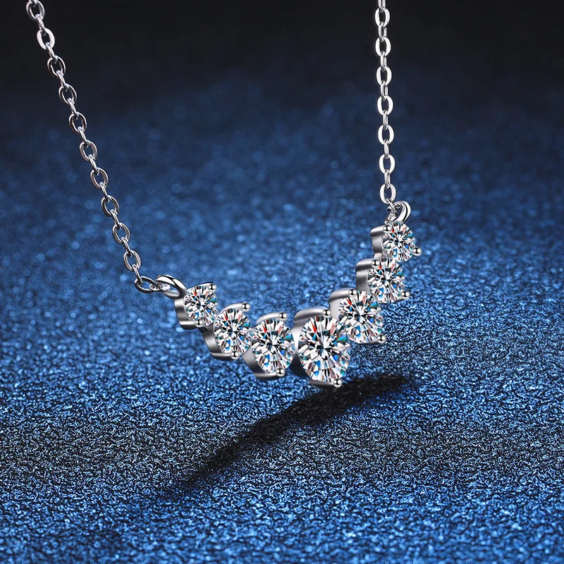 925 Sterling Silver Jewelry Necklace with Graduated Moissanite Stones and Curved Pendant Design
